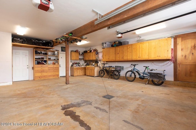 garage featuring a garage door opener