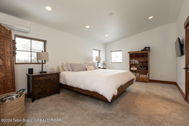 bedroom featuring light colored carpet, lofted ceiling, a wall unit AC, and recessed lighting