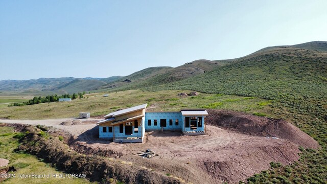 rear view of property featuring a mountain view