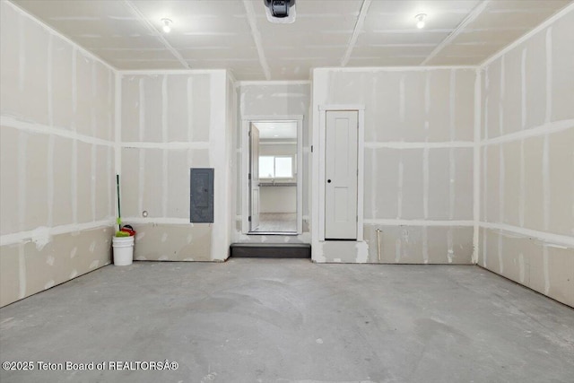 garage featuring a garage door opener and electric panel