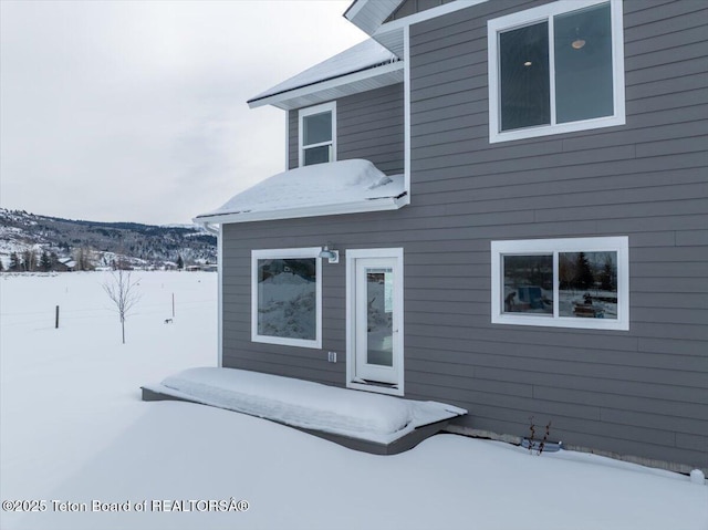 view of snow covered property entrance