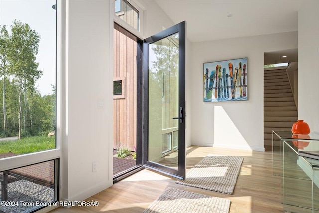 doorway with light wood-type flooring