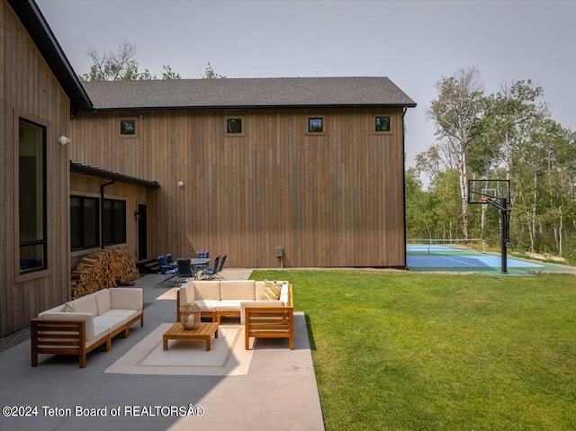 view of patio / terrace featuring basketball hoop and an outdoor living space