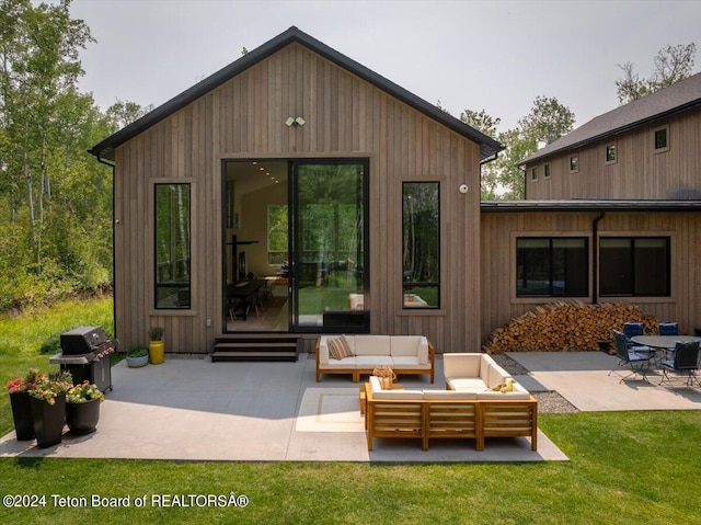 exterior space featuring a patio area, an outdoor hangout area, and a yard