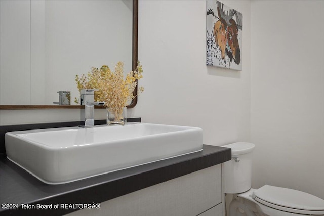 bathroom with vanity and toilet