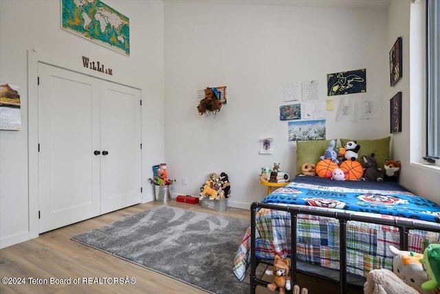 bedroom featuring a closet and light hardwood / wood-style floors