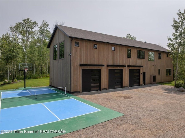 exterior space featuring basketball court and a yard