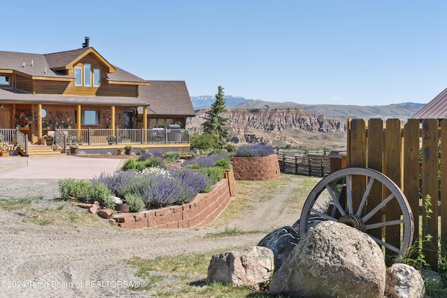 14 Table Top Dr, Dubois, WY 82513 - view of yard featuring a mountain view and a porch