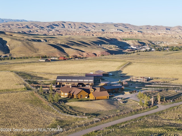 14 Table Top Dr, Dubois, WY 82513 - aerial view of property and surrounding area with rural landscape and a mountain backdrop