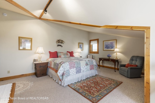 14 Table Top Dr, Dubois, WY 82513 - bedroom featuring carpet flooring, vaulted ceiling, and baseboards