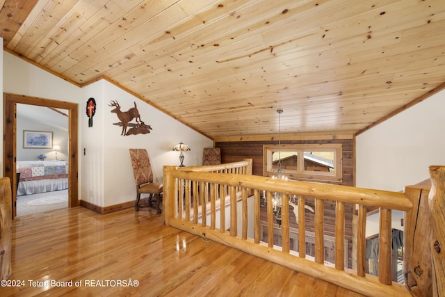 14 Table Top Dr, Dubois, WY 82513 - corridor featuring vaulted ceiling, wood finished floors, wood ceiling, an upstairs landing, and baseboards
