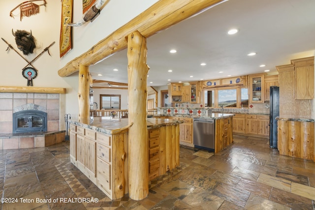 14 Table Top Dr, Dubois, WY 82513 - kitchen featuring dishwasher, recessed lighting, stone tile floors, glass insert cabinets, and decorative backsplash