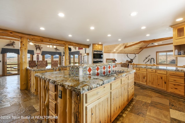 14 Table Top Dr, Dubois, WY 82513 - kitchen featuring recessed lighting, stainless steel double oven, a spacious island, black electric stovetop, and light stone countertops
