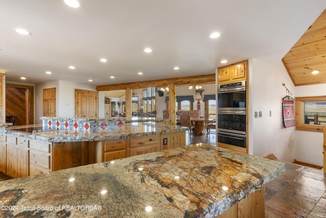14 Table Top Dr, Dubois, WY 82513 - kitchen featuring stainless steel double oven, recessed lighting, a spacious island, baseboards, and a warming drawer