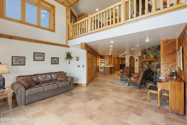 14 Table Top Dr, Dubois, WY 82513 - living area with a high ceiling, baseboards, recessed lighting, and light stone finish floors