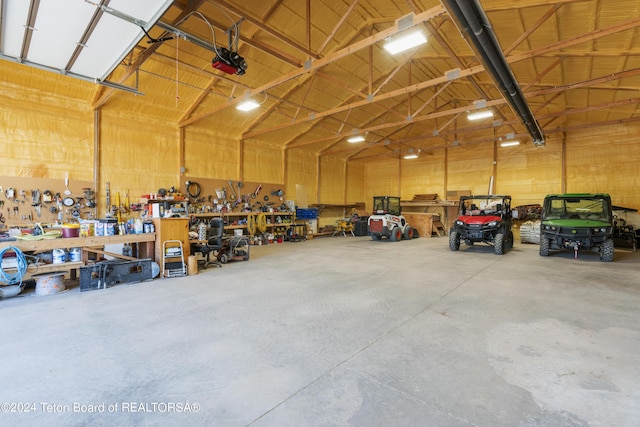 14 Table Top Dr, Dubois, WY 82513 - garage with a workshop area and a garage door opener