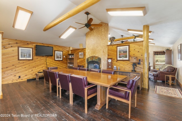 14 Table Top Dr, Dubois, WY 82513 - dining area with wooden walls, vaulted ceiling, ceiling fan, a fireplace, and wood finished floors