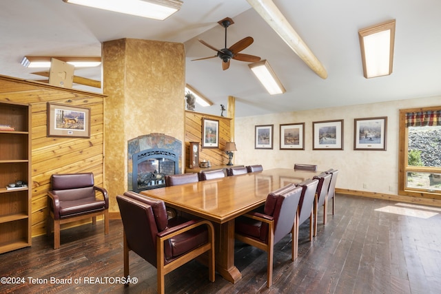 14 Table Top Dr, Dubois, WY 82513 - dining area featuring hardwood / wood-style floors, a tiled fireplace, ceiling fan, and baseboards