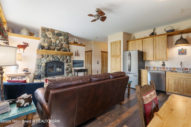 14 Table Top Dr, Dubois, WY 82513 - living area featuring ceiling fan, dark wood finished floors, and a fireplace