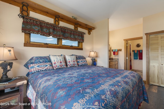 14 Table Top Dr, Dubois, WY 82513 - bedroom featuring wood finished floors and ensuite bath