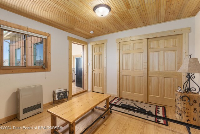28 Table Top Dr, Dubois, WY 82513 - entrance foyer with heating unit, wood finished floors, baseboards, and wood ceiling