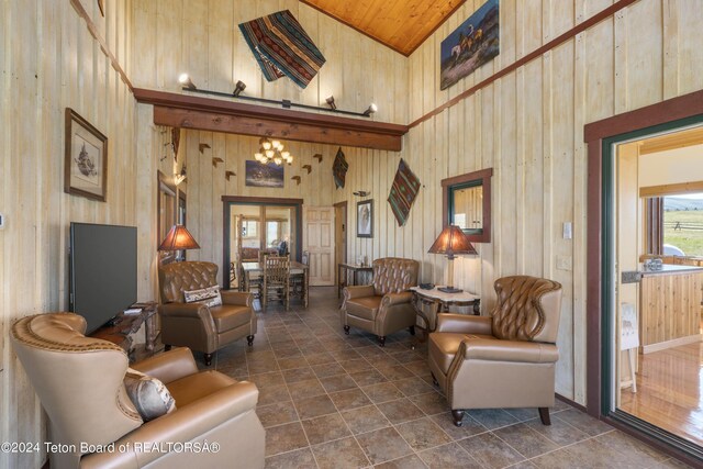 28 Table Top Dr, Dubois, WY 82513 - living room with high vaulted ceiling, wood walls, and wooden ceiling