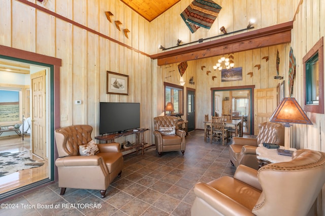 tiled living room featuring wood walls, wooden ceiling, and high vaulted ceiling