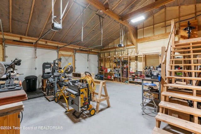 garage featuring a workshop area and a garage door opener