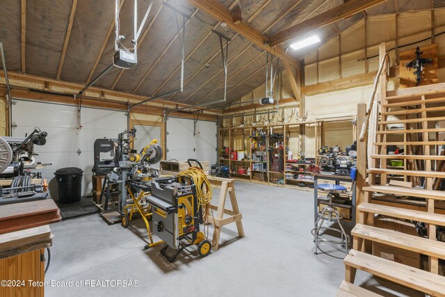 28 Table Top Dr, Dubois, WY 82513 - garage featuring a garage door opener and a workshop area