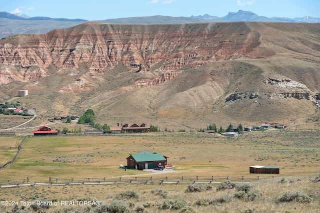 view of mountain feature with a rural view