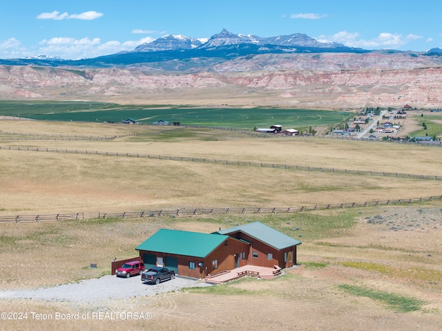 birds eye view of property with a mountain view and a rural view