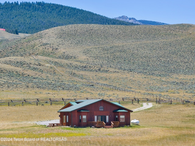 view of mountain feature with a rural view