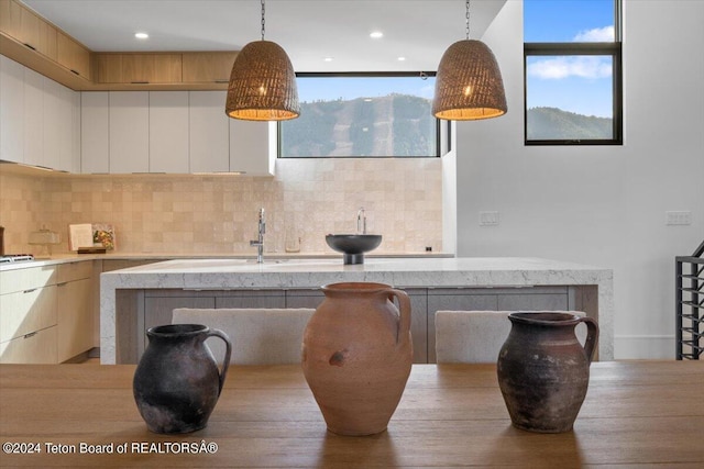 dining area featuring sink and light wood-type flooring