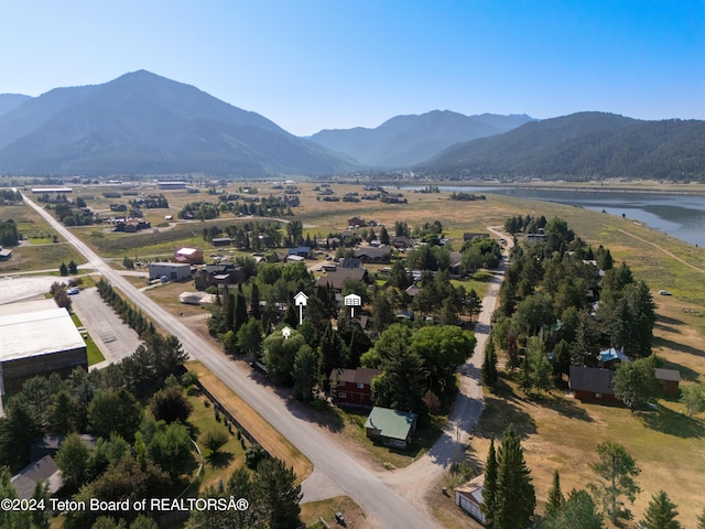 aerial view featuring a water and mountain view