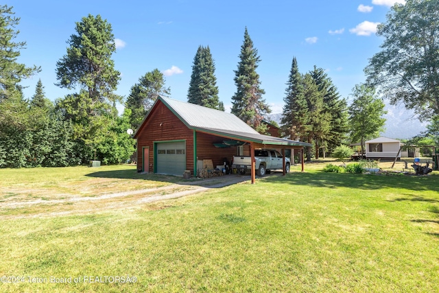 garage with aphalt driveway and a detached garage