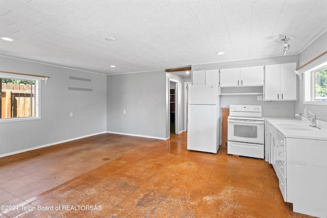 kitchen featuring white cabinetry, sink, white appliances, and light tile patterned floors