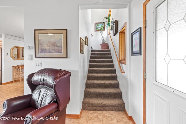 stairway with light tile patterned flooring