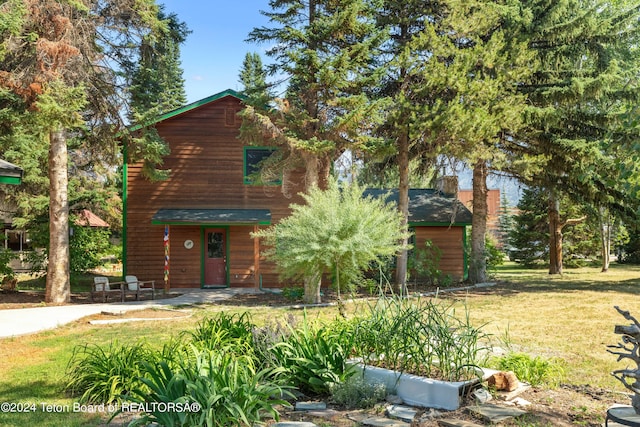 log home with a front yard