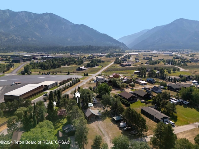 drone / aerial view featuring a mountain view