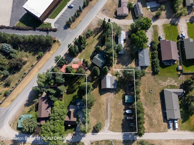 birds eye view of property with a residential view