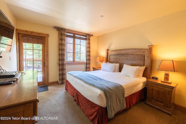 bedroom featuring access to outside and carpet floors