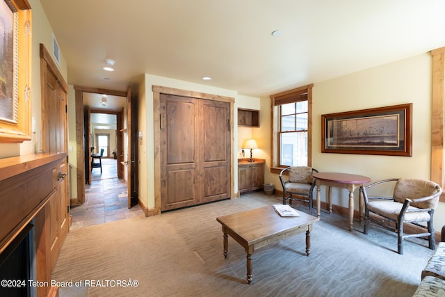 living area with light carpet