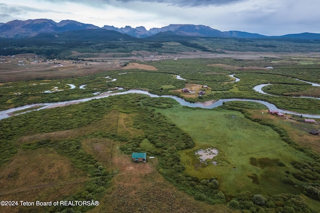 drone / aerial view with a mountain view and a rural view