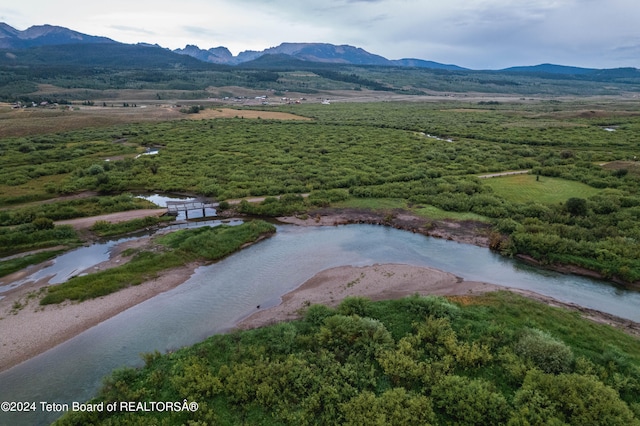 bird's eye view with a water and mountain view