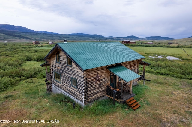 exterior space featuring a mountain view