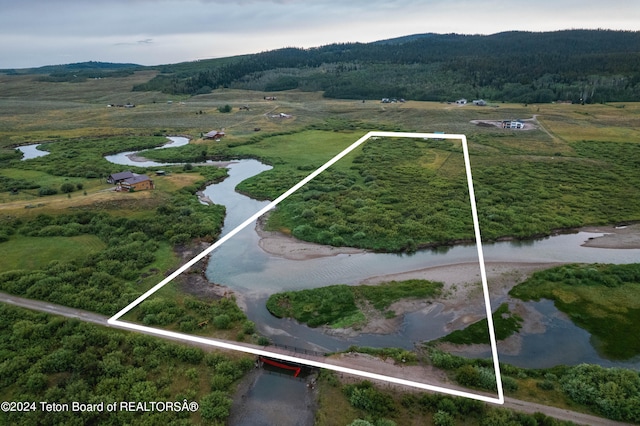 bird's eye view with a rural view and a water view