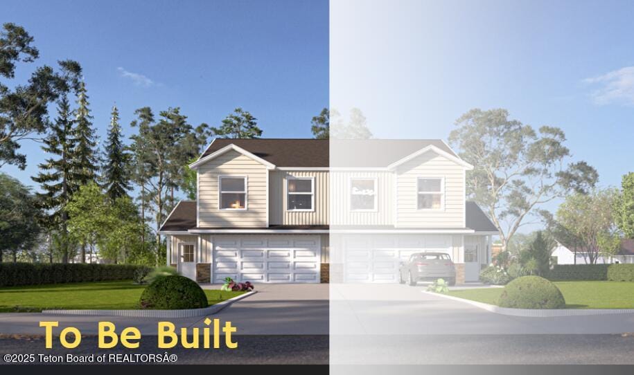 view of front of house with a front yard and a garage