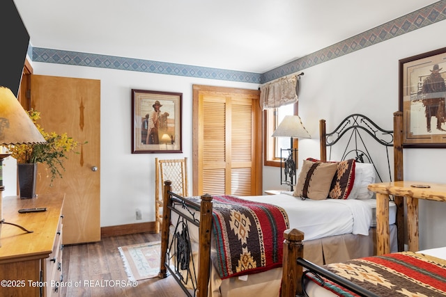 3600 W Michael Dr Unit D-4-2, Teton Village, WY 83014 - bedroom featuring wood finished floors, baseboards, and a closet