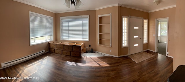 foyer entrance featuring ornamental molding, wood-type flooring, ceiling fan, and baseboard heating