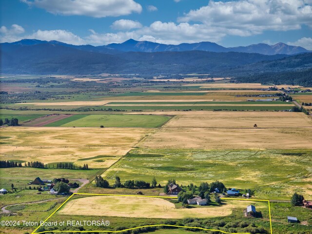 birds eye view of property featuring a rural view and a mountain view